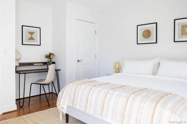 a bedroom with a bed and a table