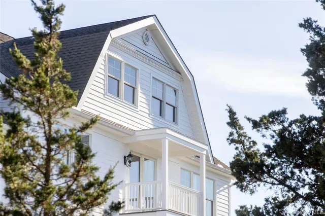 a view of a house with a tree