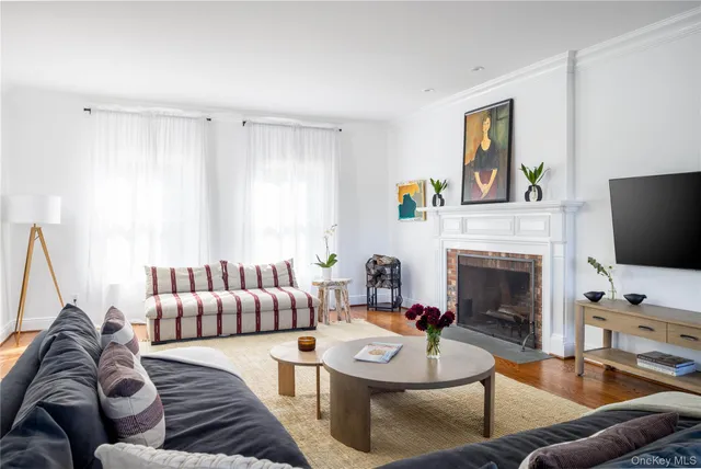 a living room with furniture fireplace and a flat screen tv