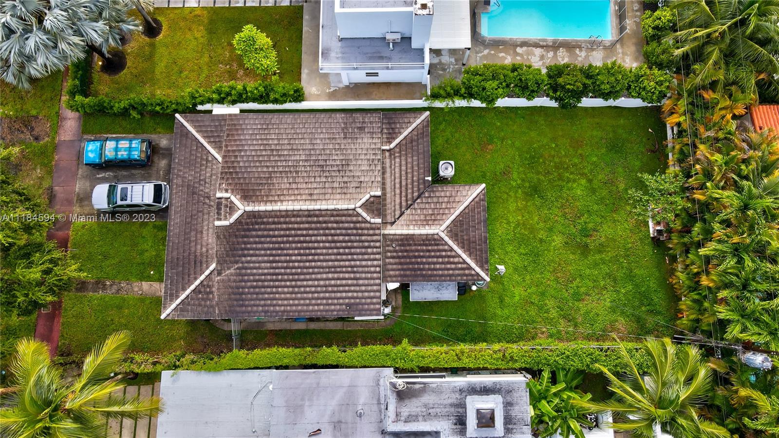 a aerial view of a house with garden space and lake view