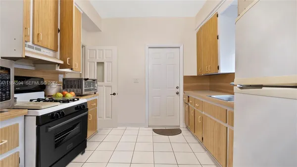 a kitchen with a sink and a window