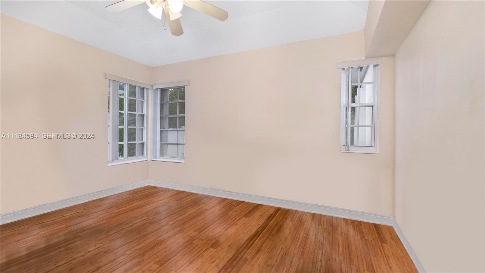 535 West 51st Street Miami Beach, FL 33140 - Photo 16 of 40 a view of empty room with wooden floor and fan