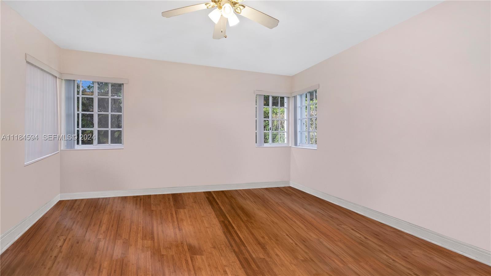 535 West 51st Street Miami Beach, FL 33140 - Photo 18 of 40 wooden floor in an empty room with a window