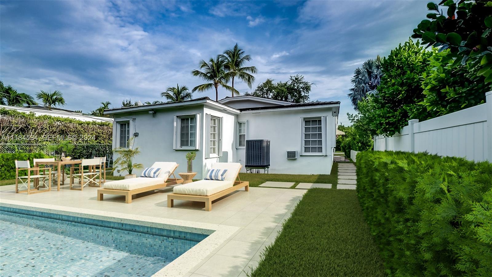535 West 51st Street Miami Beach, FL 33140 - Photo 27 of 40 a view of a house with backyard sitting area and garden