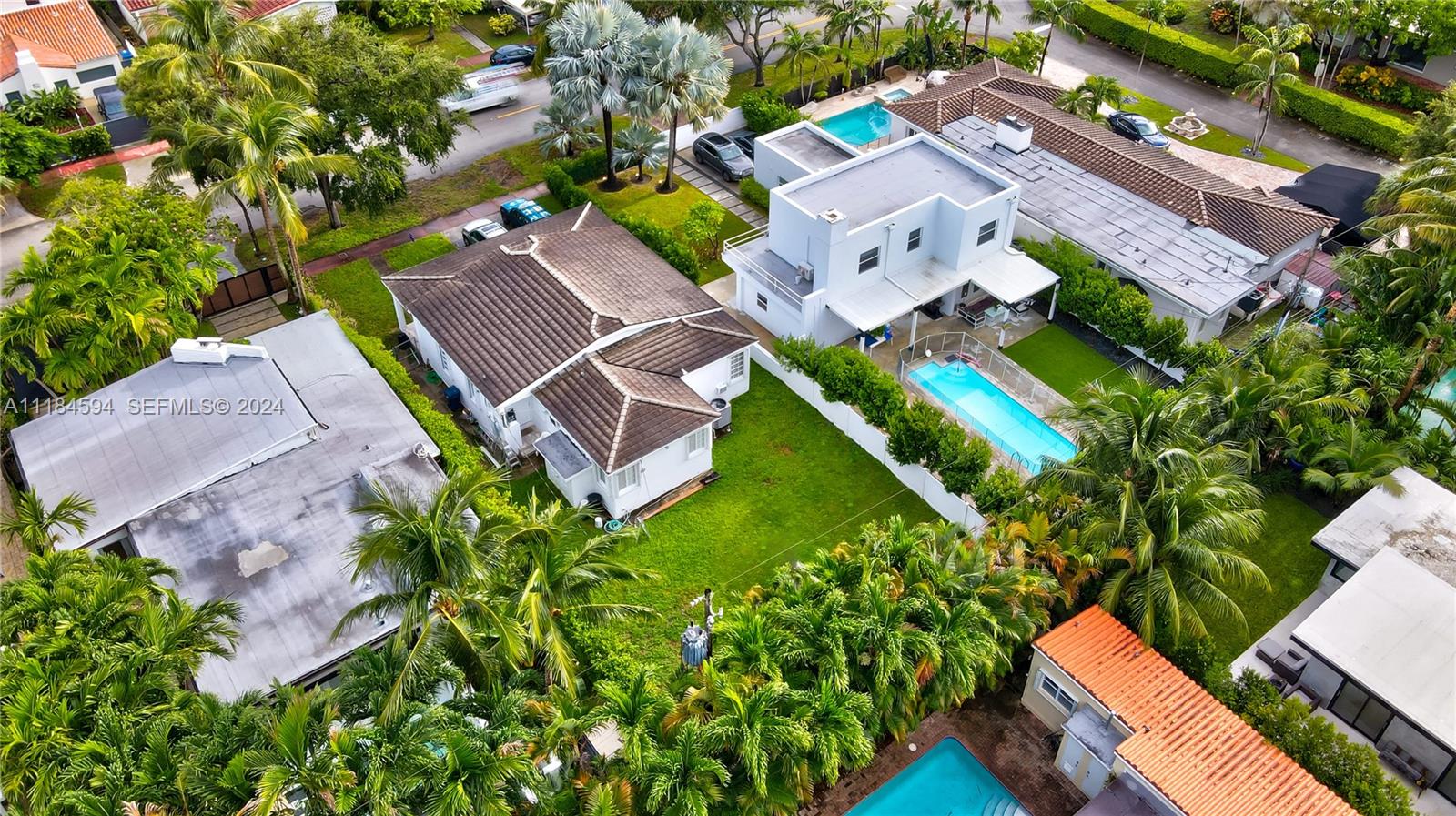 535 West 51st Street Miami Beach, FL 33140 - Photo 32 of 40 an aerial view of a house with a garden and swimming pool