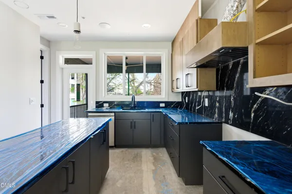 a kitchen with granite countertop lots of counter top space