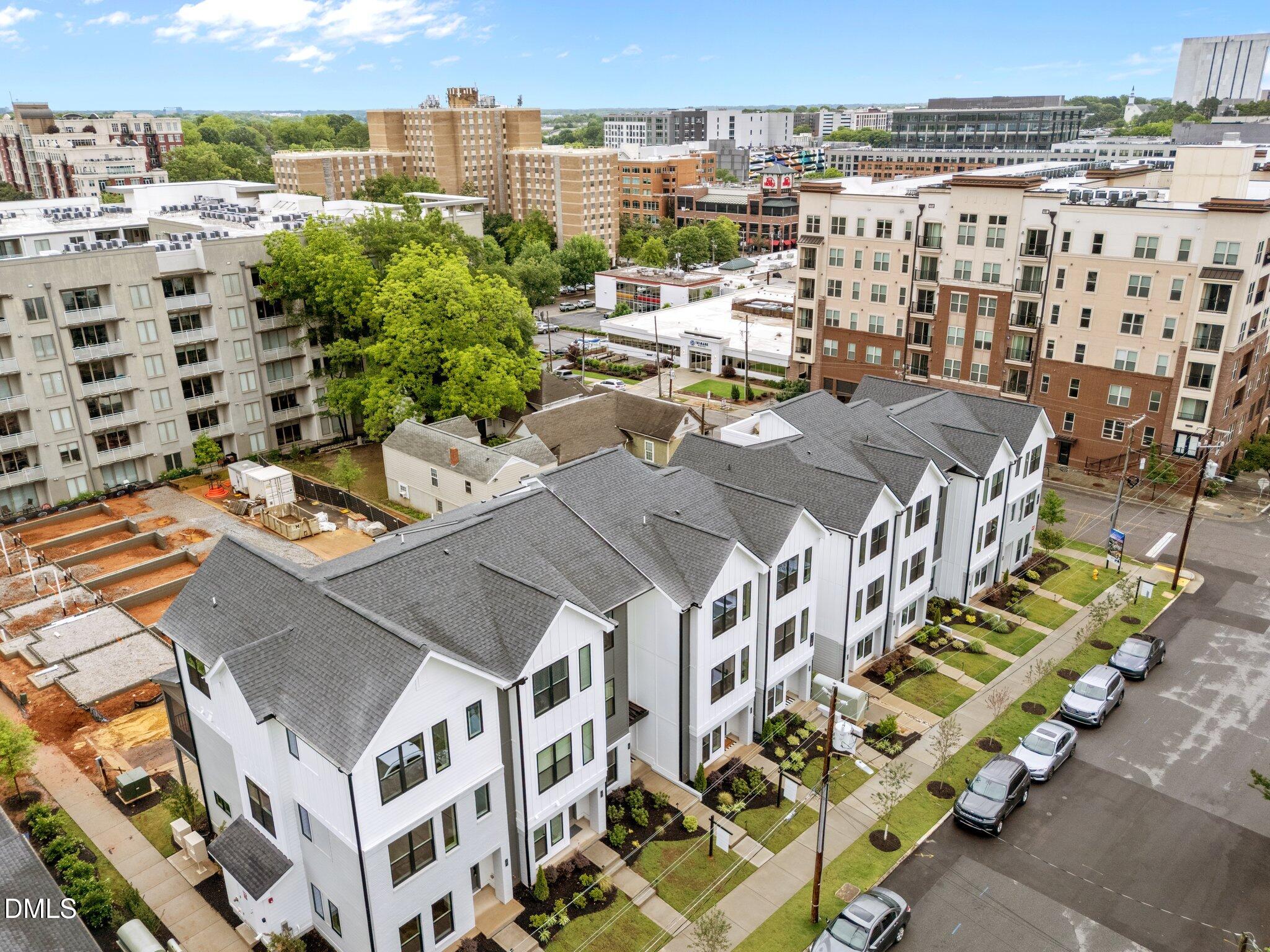 720 Noble Town Way, Unit 105 Raleigh, NC 27603 - Photo 30 of 35 a view of a city that has tall buildings