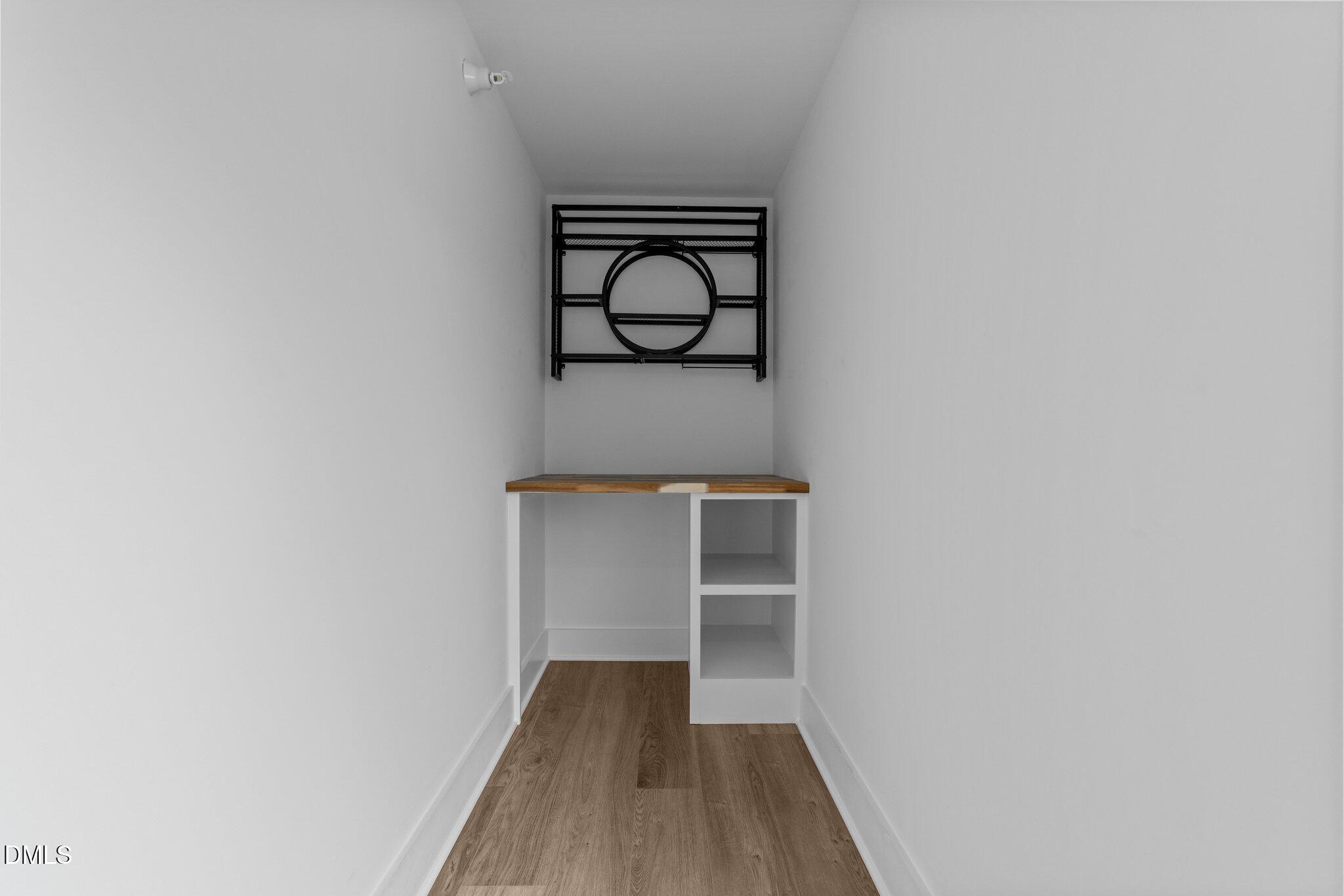 720 Noble Town Way, Unit 105 Raleigh, NC 27603 - Photo 4 of 35 a view of a hallway with wooden floor