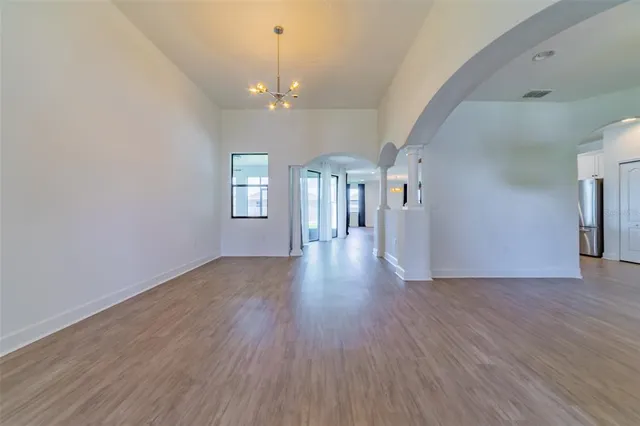 a front view of a house with swimming pool having outdoor seating
