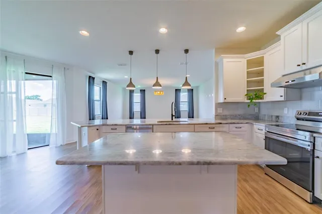 a white bath tub sitting next to a shower