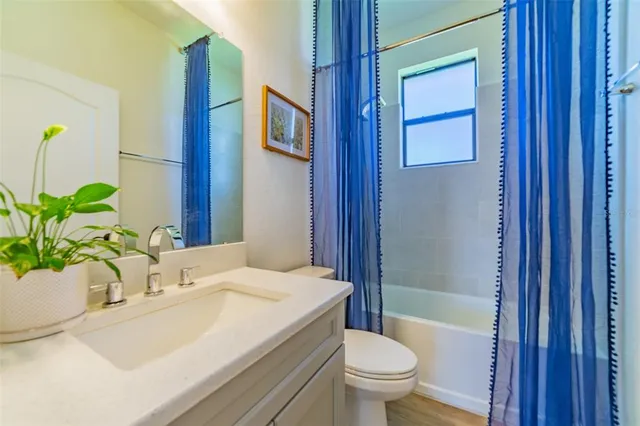 a view of a livingroom with furniture and a window