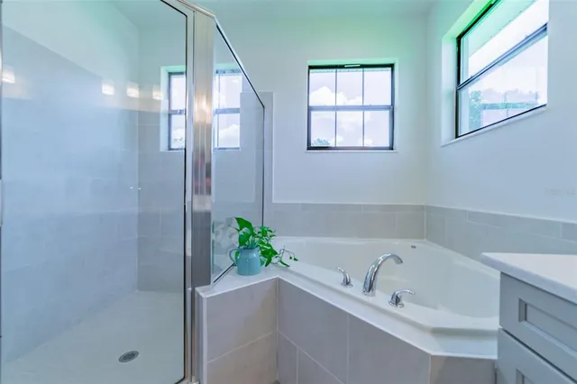 a view of sign board with flower plants