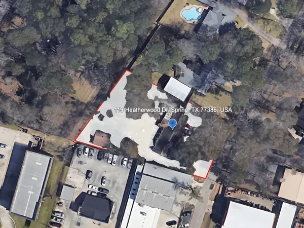 a white bath tub sitting next to a white bed