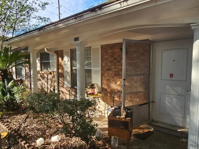 a view of a park with a tree