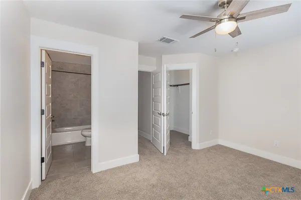 an empty room with a bathroom