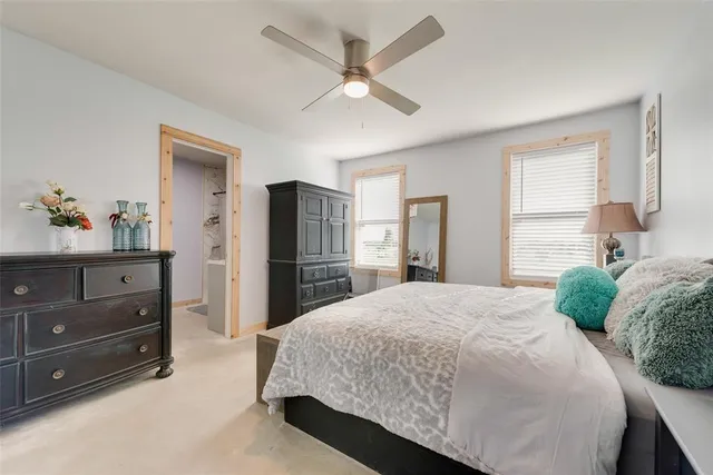 a bedroom with a bed and a dresser