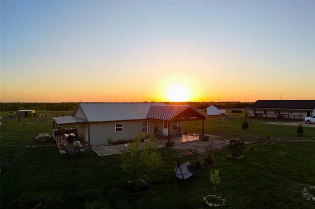 a view of a balcony with floor to ceiling windows