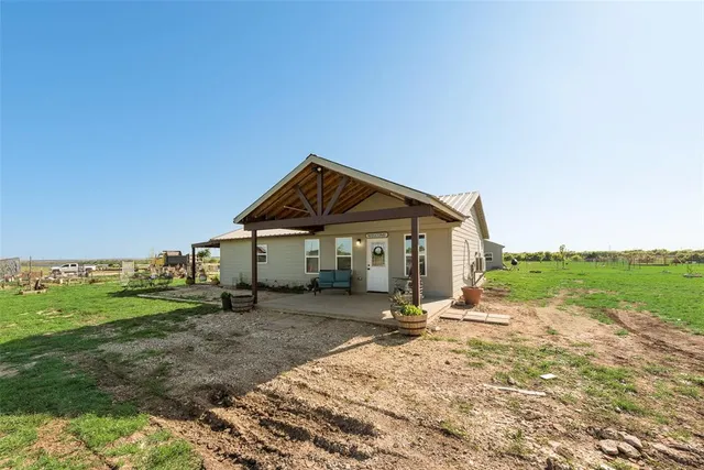 a dirt road with an ocean view