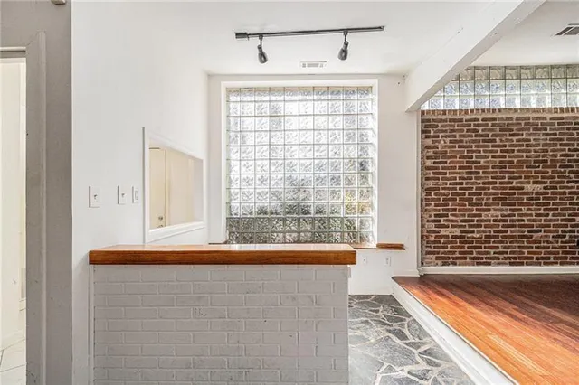 a front view of a house with a large window