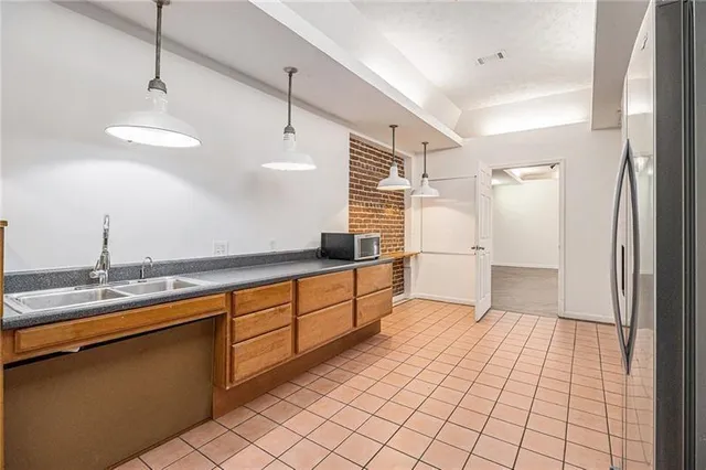 a large bathroom with a sink a mirror and a shower