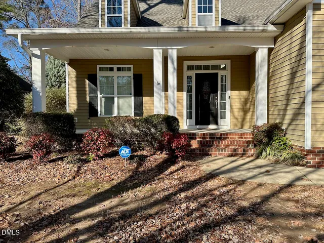 front view of a house with a large window
