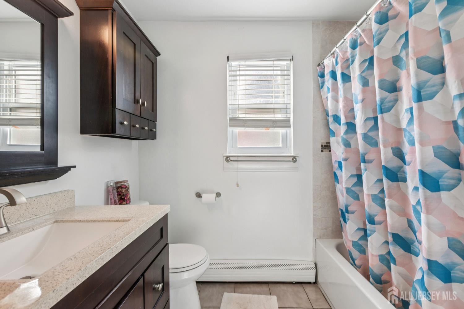37 York Drive, Unit 6A Edison, NJ 08817 - Photo 12 of 20 a bathroom with a sink toilet and shower