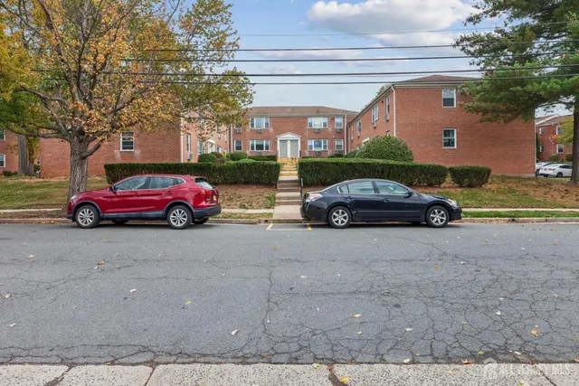 a front view of a house with parking area