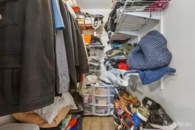 a view of gym equipment with clothes and shoes