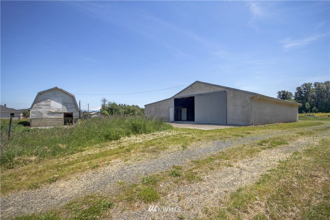 2353 Grandview Road Ferndale, WA 98248 - Photo 2 of 40 a view of a big house with a yard and garage