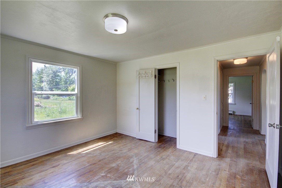 2353 Grandview Road Ferndale, WA 98248 - Photo 20 of 40 an empty room with wooden floor and windows