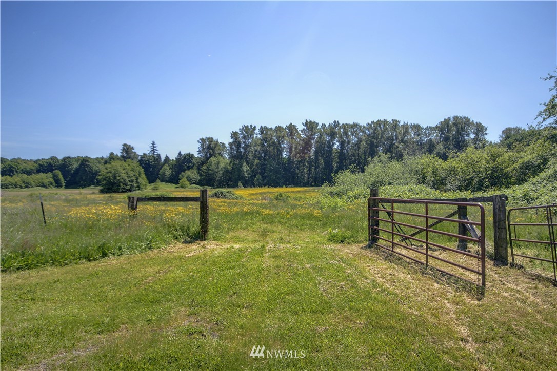 2353 Grandview Road Ferndale, WA 98248 - Photo 38 of 40 a view of a green field with wooden fence