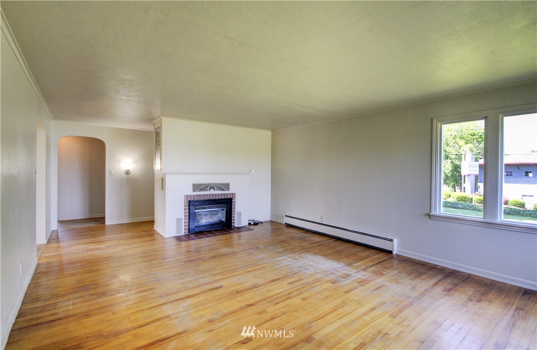 2353 Grandview Road Ferndale, WA 98248 - Photo 8 of 40 a view of empty room with wooden floor and fan