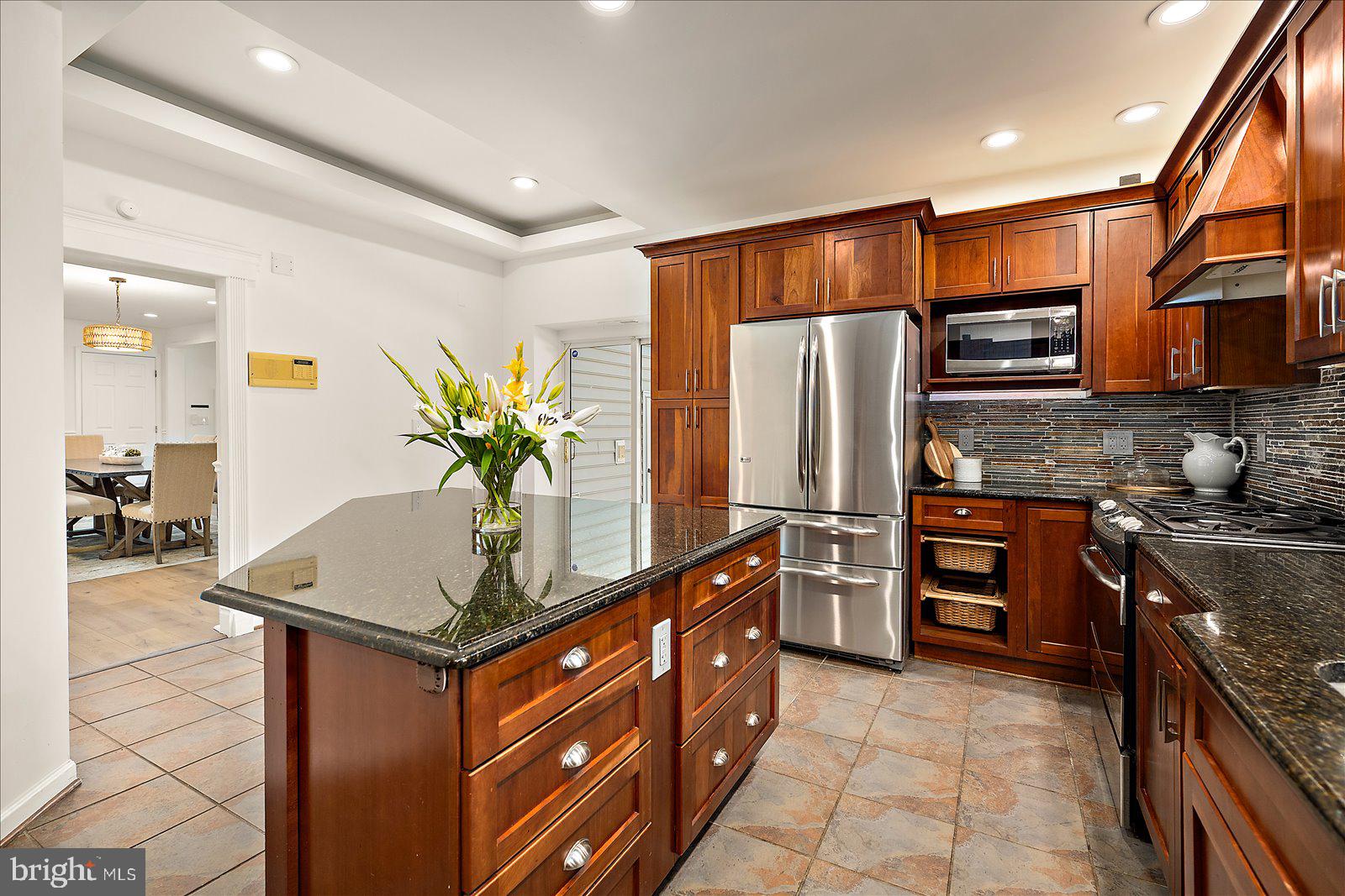 813 Shore Drive Edgewater, MD 21037 - Photo 12 of 64 a kitchen with stainless steel appliances granite countertop a refrigerator a stove and a sink