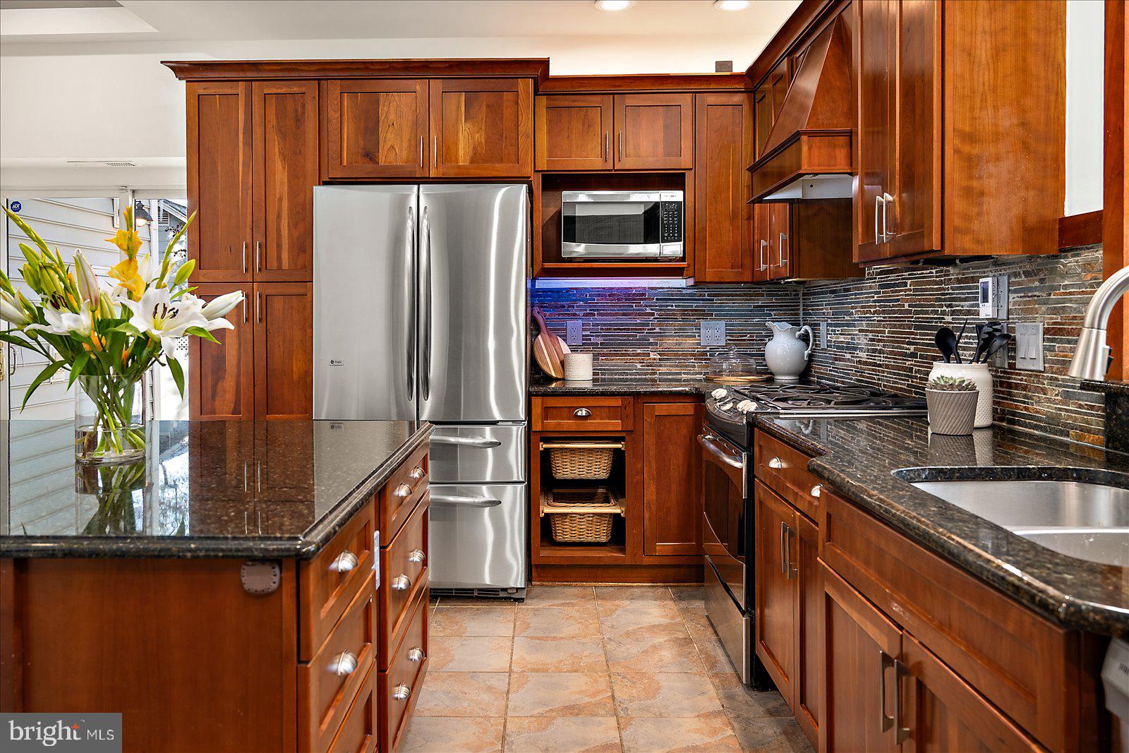 813 Shore Drive Edgewater, MD 21037 - Photo 14 of 64 a kitchen with stainless steel appliances granite countertop a refrigerator and a sink
