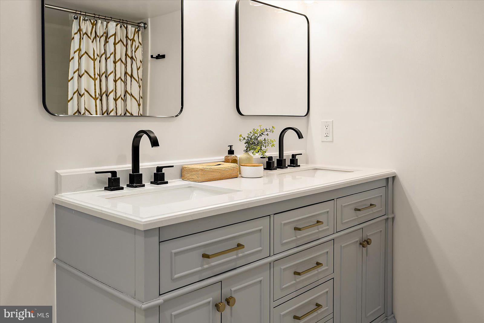 813 Shore Drive Edgewater, MD 21037 - Photo 20 of 64 a bathroom with a sink and a mirror