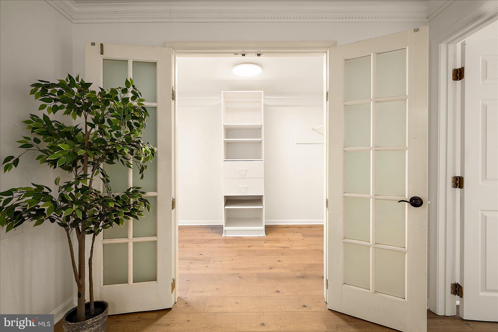 813 Shore Drive Edgewater, MD 21037 - Photo 21 of 64 a view of a hallway with closet and a potted plant
