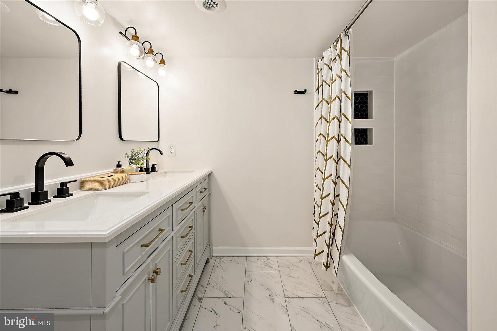 813 Shore Drive Edgewater, MD 21037 - Photo 23 of 64 a bathroom with a sink and a mirror