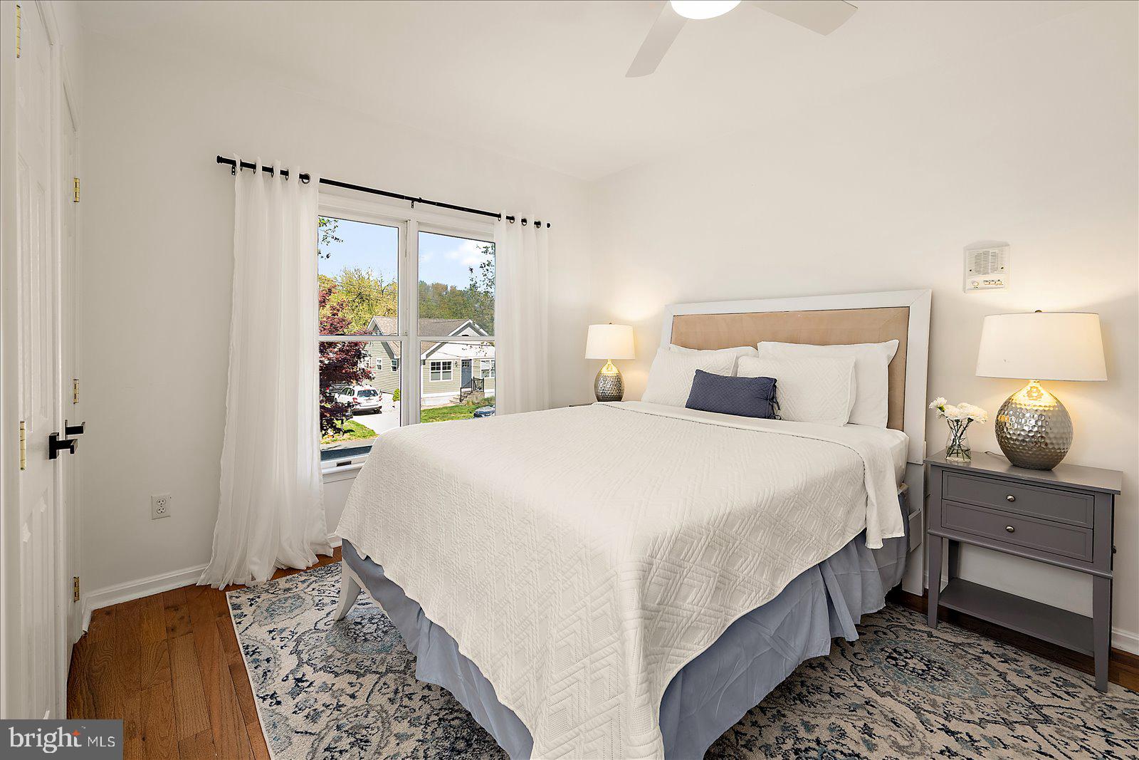 813 Shore Drive Edgewater, MD 21037 - Photo 29 of 64 a bedroom with a bed and a mirror