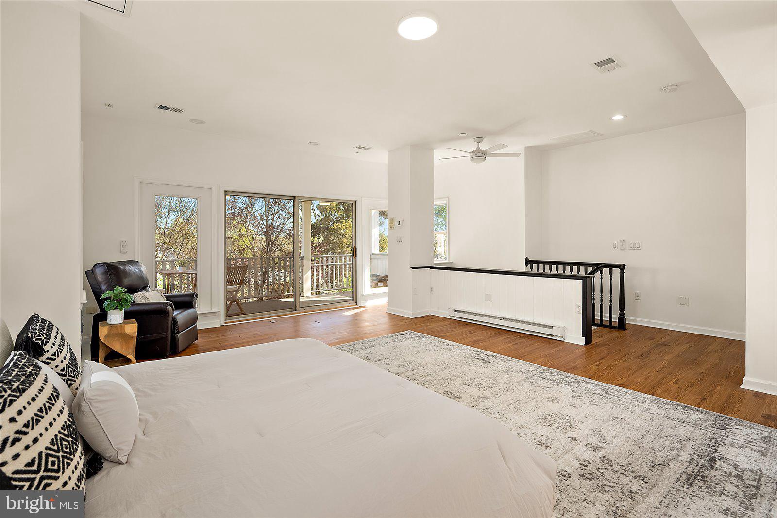 813 Shore Drive Edgewater, MD 21037 - Photo 38 of 64 a spacious bedroom with a bed and a large window