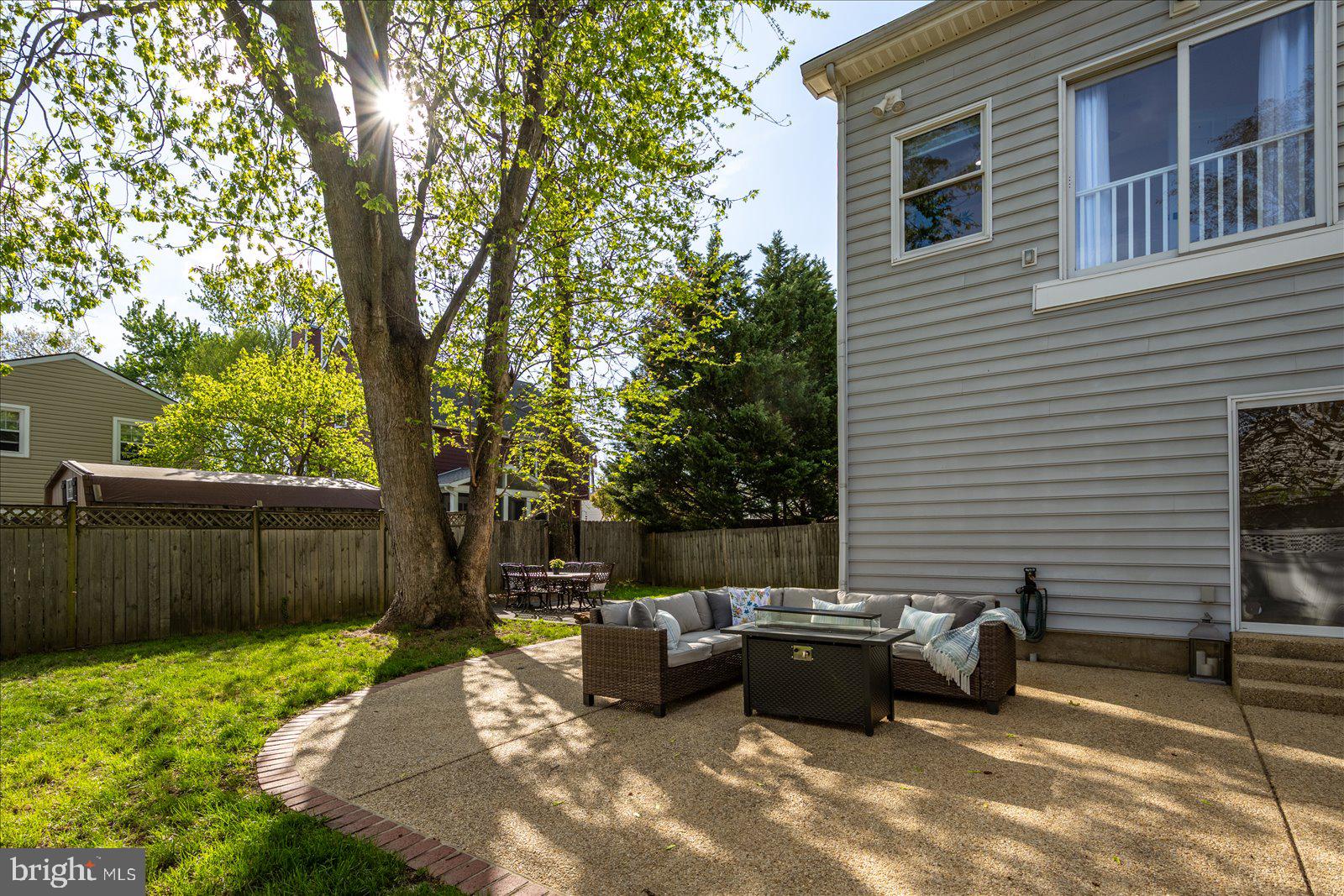 813 Shore Drive Edgewater, MD 21037 - Photo 43 of 64 a view of a patio with couches chairs and a fire pit