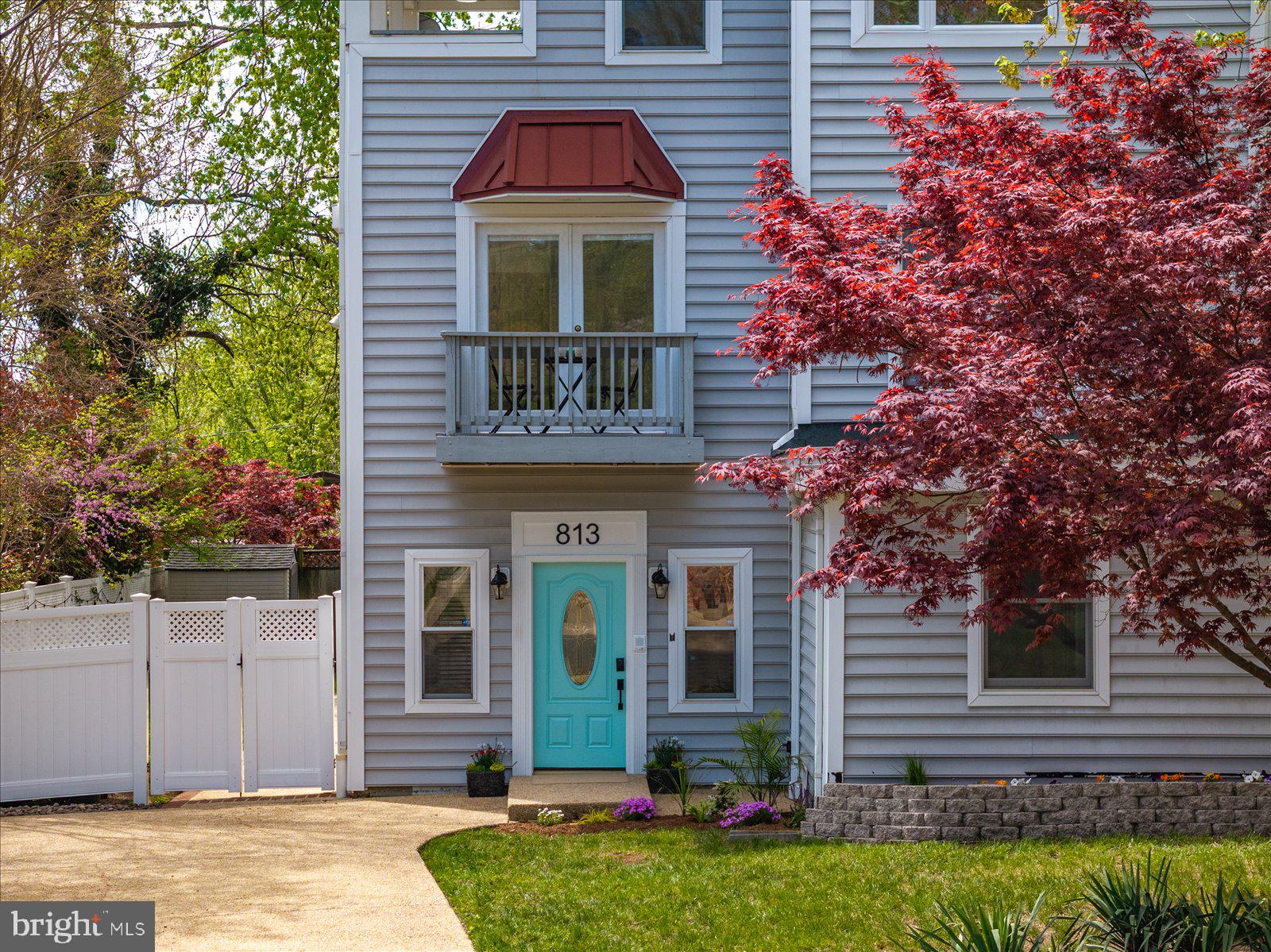 813 Shore Drive Edgewater, MD 21037 - Photo 46 of 64 a front view of a house with garden