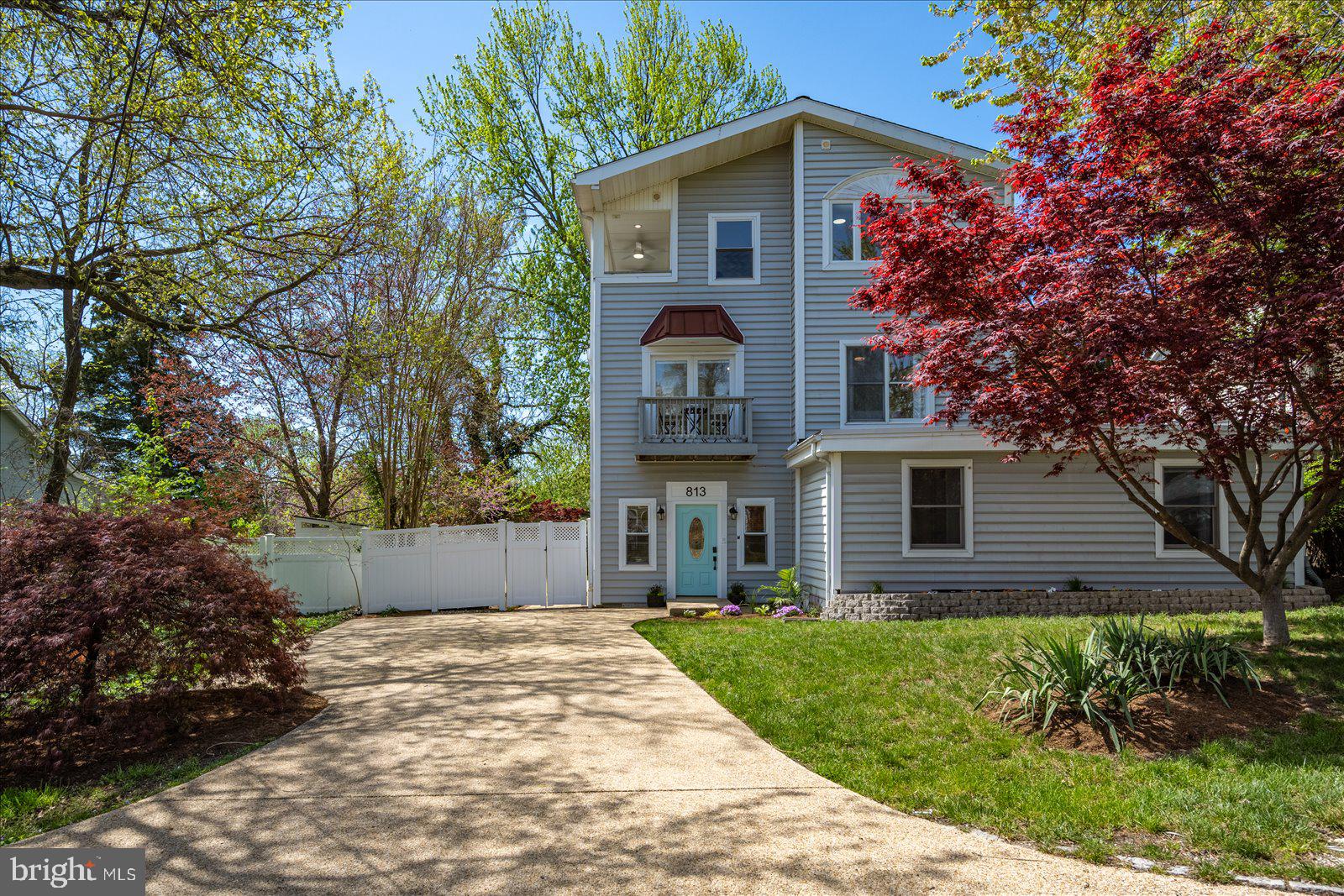 813 Shore Drive Edgewater, MD 21037 - Photo 47 of 64 a front view of a house with a garden