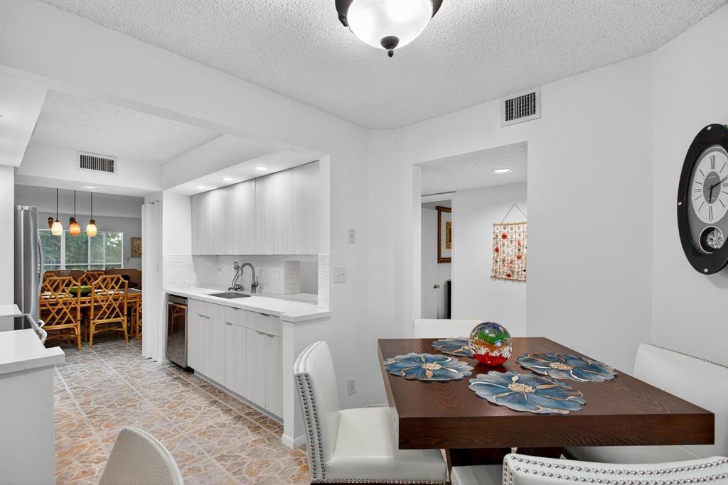 1801 Eleuthera Point, Unit D3 Coconut Creek, FL 33066 - Photo 11 of 80 a living room with furniture and a table