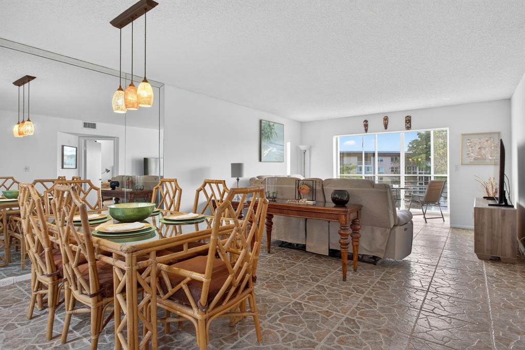 1801 Eleuthera Point, Unit D3 Coconut Creek, FL 33066 - Photo 13 of 80 a view of a dining room with furniture