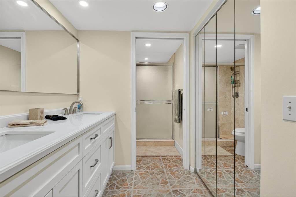 1801 Eleuthera Point, Unit D3 Coconut Creek, FL 33066 - Photo 28 of 80 a bathroom with a granite countertop sink mirror and shower