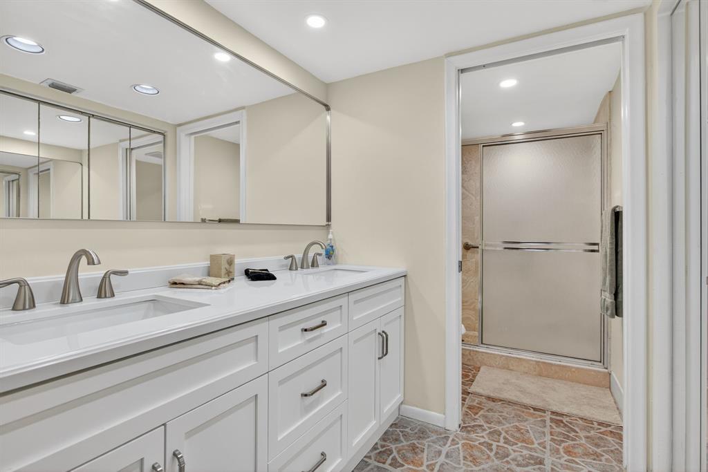 1801 Eleuthera Point, Unit D3 Coconut Creek, FL 33066 - Photo 29 of 80 a bathroom with a double vanity sink mirror and double