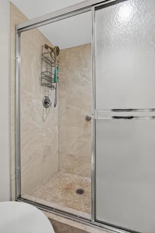 a view of a swimming pool and trees in the back