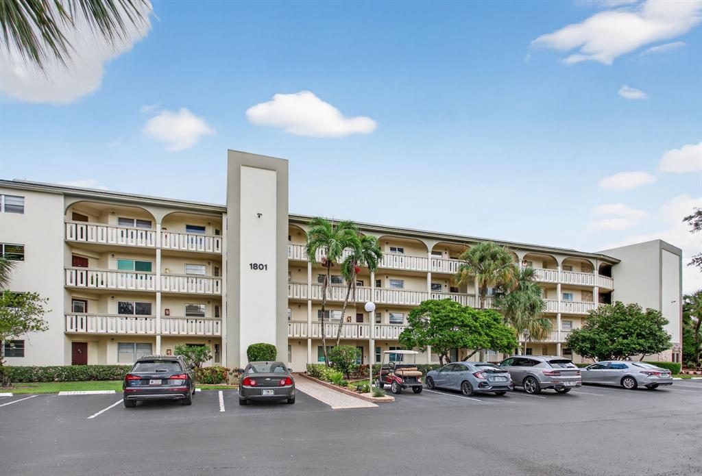 1801 Eleuthera Point, Unit D3 Coconut Creek, FL 33066 - Photo 40 of 80 a car parked in front of a building