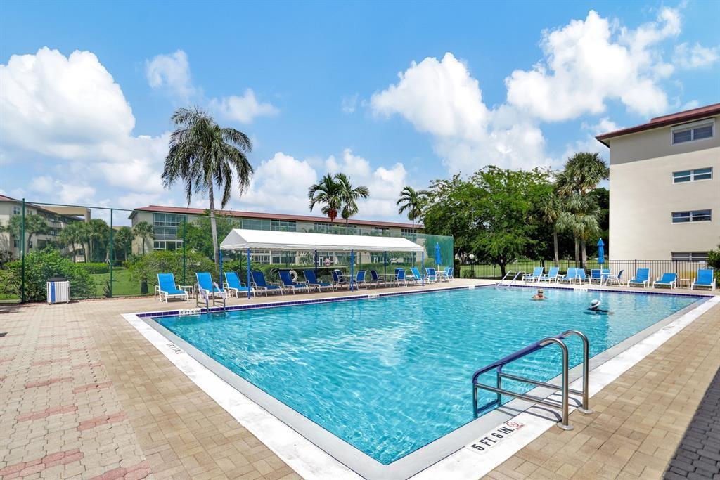 1801 Eleuthera Point, Unit D3 Coconut Creek, FL 33066 - Photo 41 of 80 a view of a backyard with swimming pool