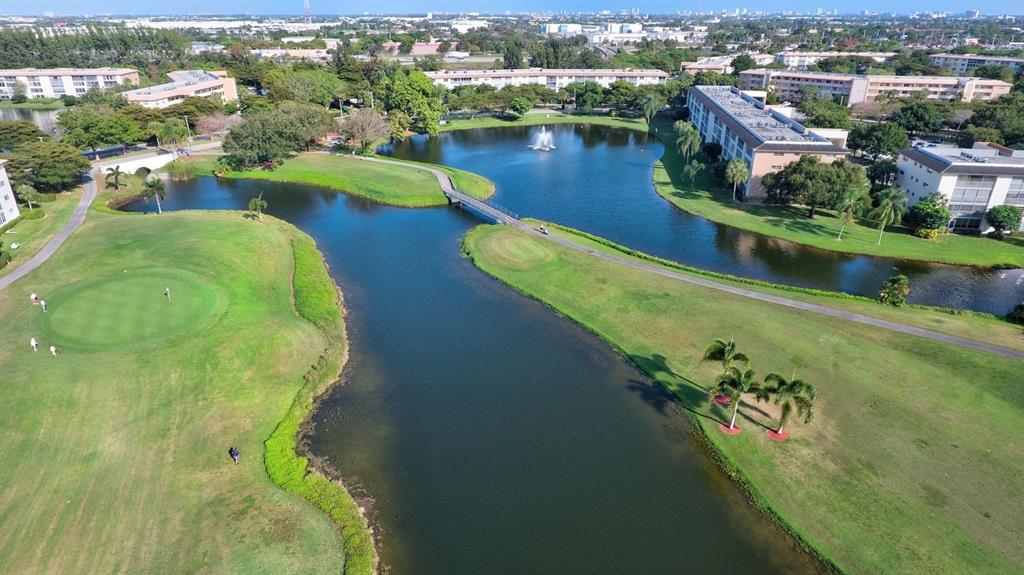 1801 Eleuthera Point, Unit D3 Coconut Creek, FL 33066 - Photo 51 of 80 an aerial view of a house with a swimming pool yard and outdoor seating